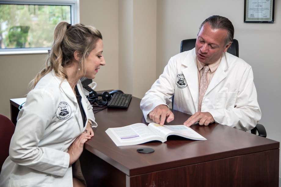 SMU student working with faculty member