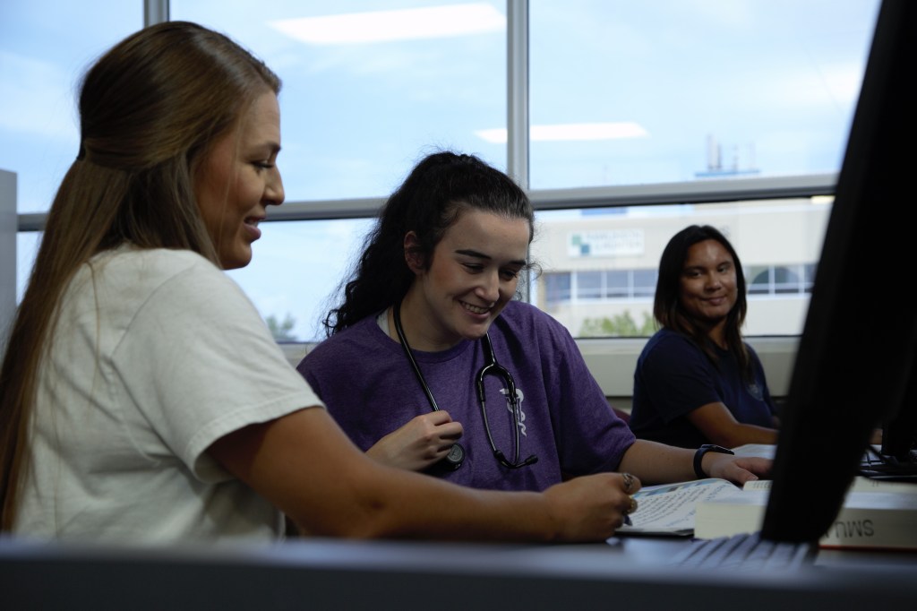 SMU Veterinary Students studying in library