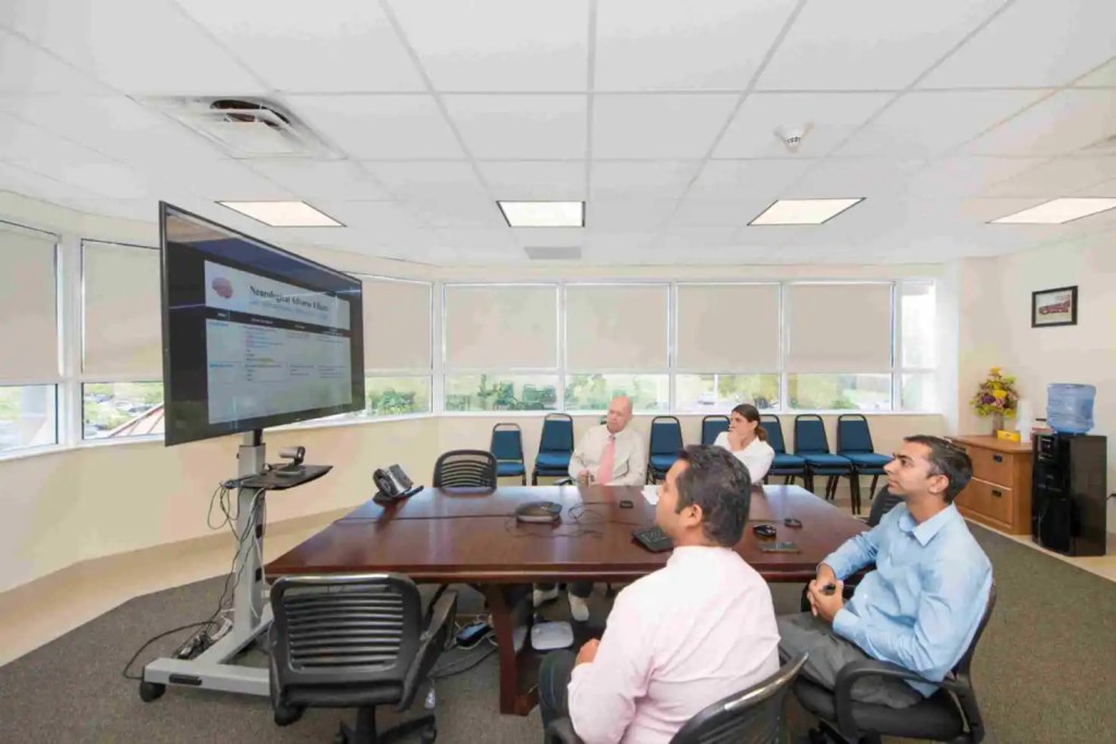 SMU Faculty members working in conference room